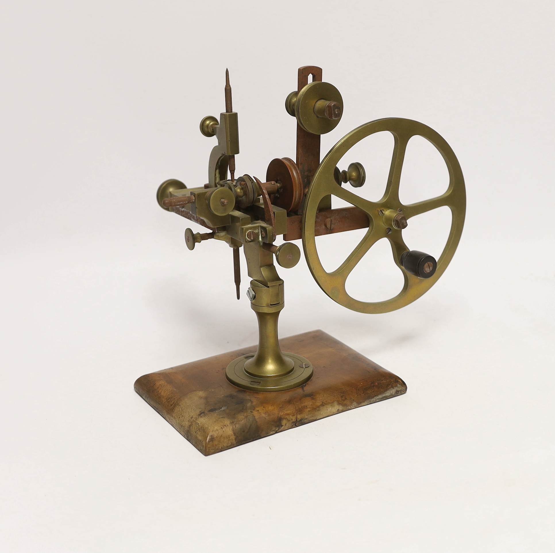 An early 20th century watchmaker's topping tool, for adapting the profile of teeth on watch wheels, 23cm high